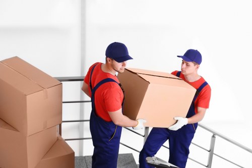 Removal team loading items safely into a van