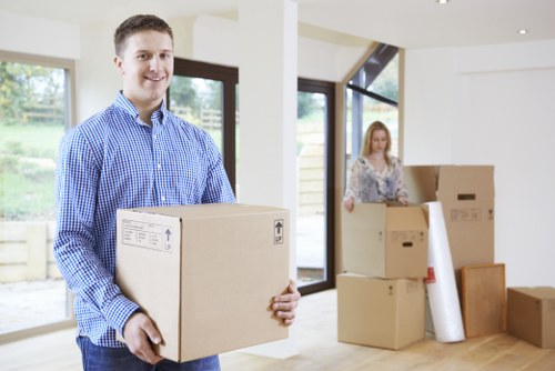 Local movers transporting household items through a Marylebone property