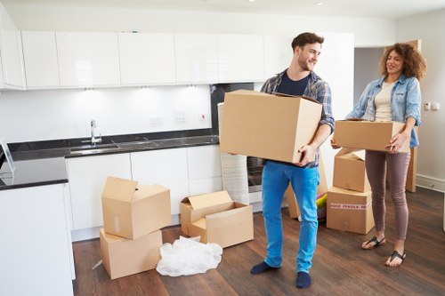Professional movers carrying furniture in Marylebone