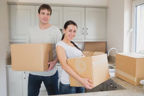 Professional movers handling household items inside a Marylebone apartment building